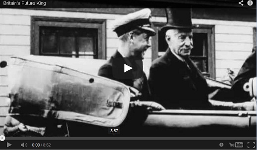 Black and white image of three women, smiling in a crowd.