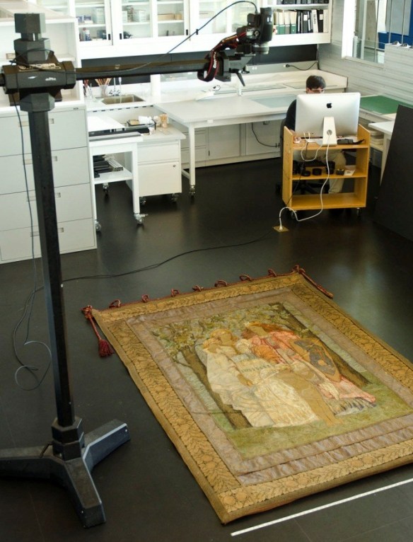 The camera is positioned above the banner, which is laid on the floor.