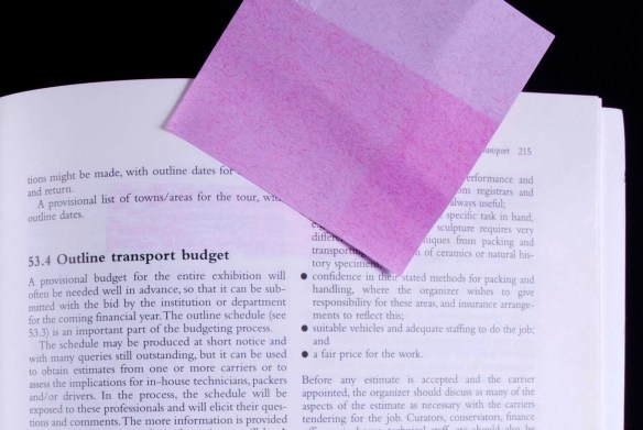 Evidence of glue residue on a page after a sticky note is removed 