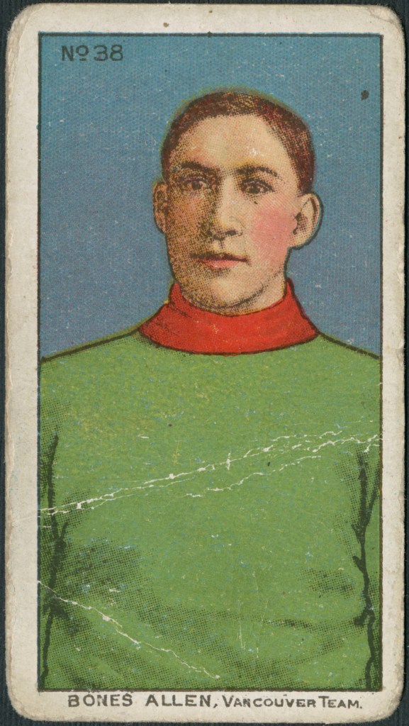 A trading card with a colour print of a man wearing a plain green sweater with a red collar. It is captioned: “Bones Allen, Vancouver Team.”