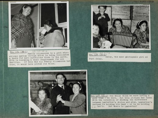 Photograph of a green album page with three black and white photographs (numbered 154, 156, and 157) with typed captions on white paper. The photograph in the top left corner is of an Inuit woman in a plain dress and plaid shawl standing on a porch with a little girl in a parka drinking glass of milk. The photograph in the top right corner is of two Inuit women in plaid shawls and flower headbands sitting in front of wooden crates, one holding an accordion, with a baby sitting in the foreground to the left and a little boy in dress clothes standing beside the woman with the accordion. The photograph at the bottom of the page is of a woman in a blazer and ribbon headband dancing with a man in a suit; the woman on the left is holding a man’s hand – the rest of the man is out of the shot – and there are three women and an oil lamp in the background.