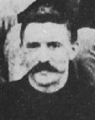 Detail from a black-and-white photograph of the first basketball team. 