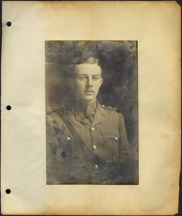 A yellowed black-and-white photograph of an officer in uniform.
