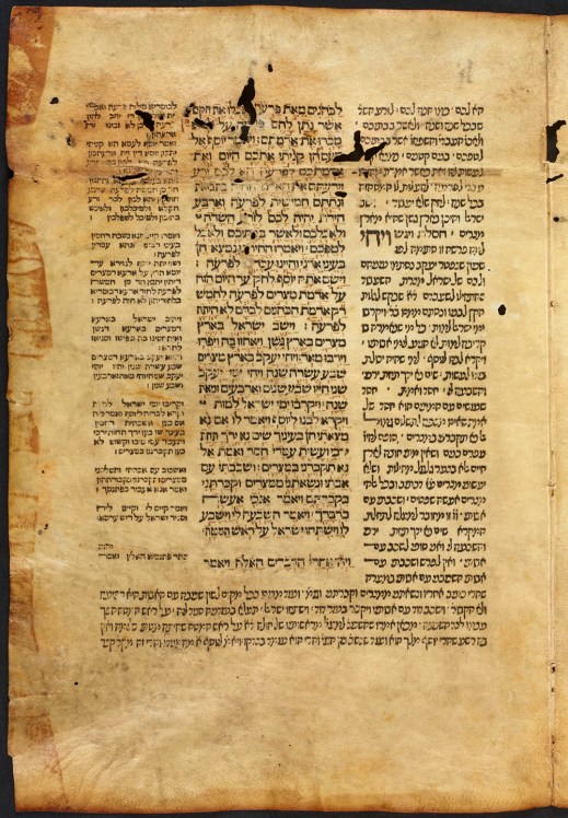 A colour photograph of a yellowed, printed page written in Hebrew.