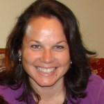 A colour photograph of a woman with a very broad smile.