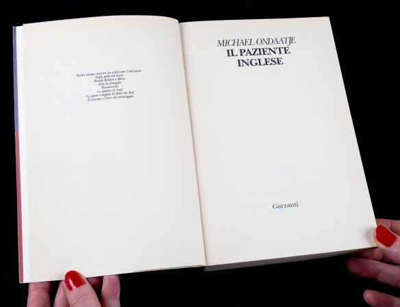 Colour photograph of a book open at the title page: Michael Ondaatje Il Paziente Inglese.