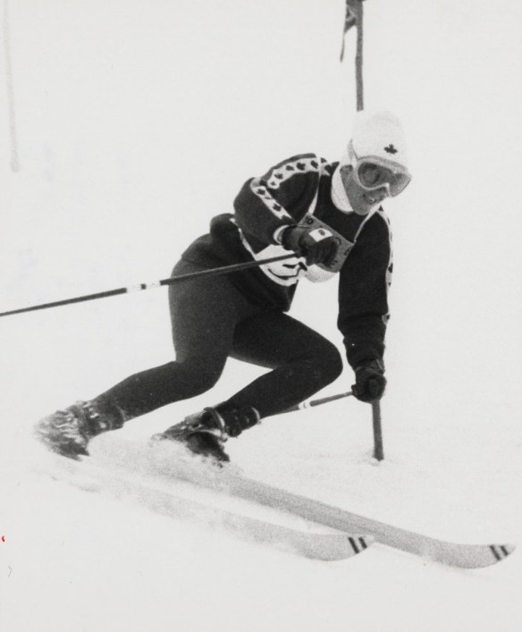A black-and-white photograph of Nancy Greene during her silver medal run in slalom.