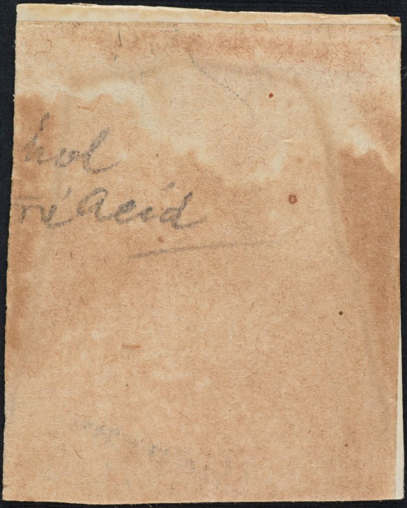 A colour image of a stained piece of paper with partial text “hol” and “acid” written on it.