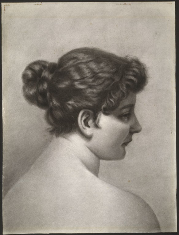 A charcoal drawing on paper of a young woman with bare shoulders seen from the back with her face in profile. Her hair is styled in a loose bun with short curls framing her face. Her gaze is off to the right.