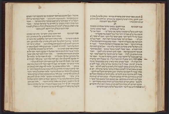 A colour photograph of an open book with Hebrew writing.
