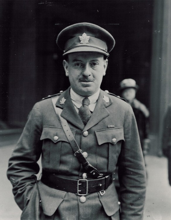 A black-and-white photograph of a soldier standing with his right hand in his trouser pocket.