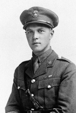 A black-and-white photograph of a soldier wearing a cap and a Sam Brown belt, part of an officer’s uniform. 