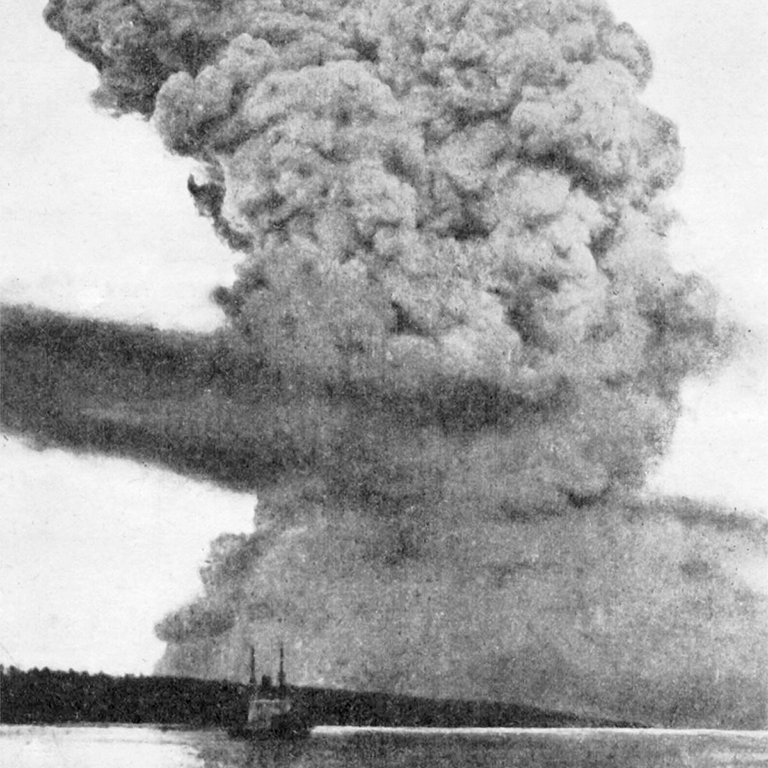 A black and white photo of smoke rising over the Halifax harbour
