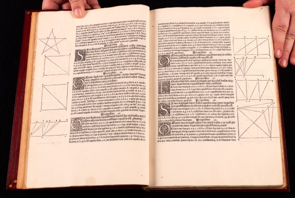 A colour photograph of two pages of illustrated text from an early printed book.