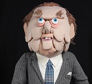Colour image of a puppet that resembles Prime Minister John Diefenbaker.