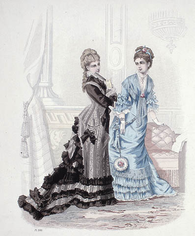 A colour plate of two women standing in a living room. One is wearing a blue dress with ruffles at the sleeves and hem. The other is wearing a striped black and grey dress with a long bustle and ruffles at the hem.