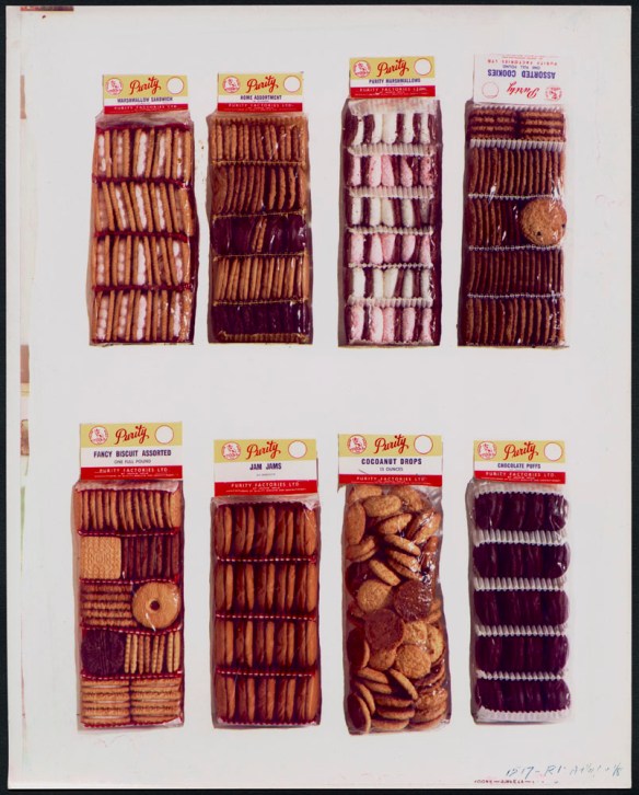 A promotional photograph displaying eight different Purity biscuit and cookie products in clear bags against a white background.