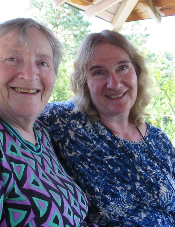 Chava Rosenfarb sitting with her daughter, Goldie Morgentaler. Dr. Morgentaler is sitting on the right and has her arm over Rosenfarb’s shoulders. 