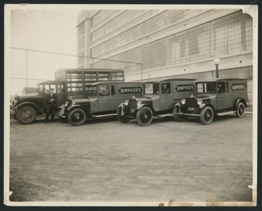 Three black-and-white photographs showing men dressed in uniforms beside Simpson’s delivery trucks, over the decades.