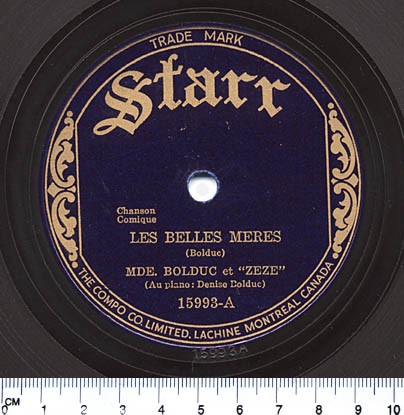 A colour picture of the label of the song “Les Belles Mères” with golden lettering on a navy disk.