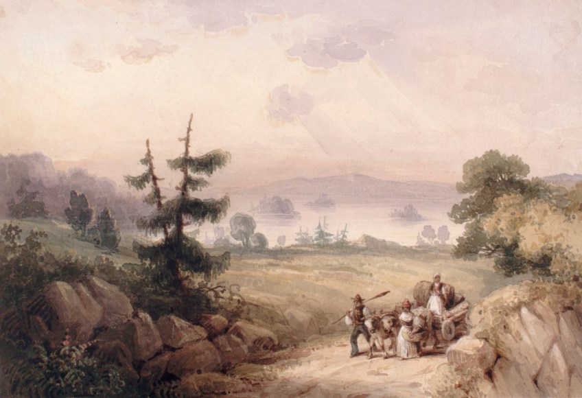 Two people walking along a dirt road beside a cart, in which one person is sitting.