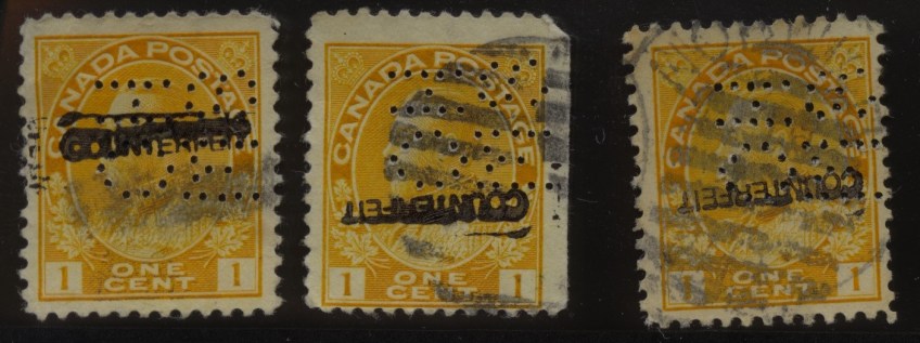 Three one-cent Canada Postage stamps, each with a portrait of King George V, maple leaves and crowns, and forged OHMS perforations.