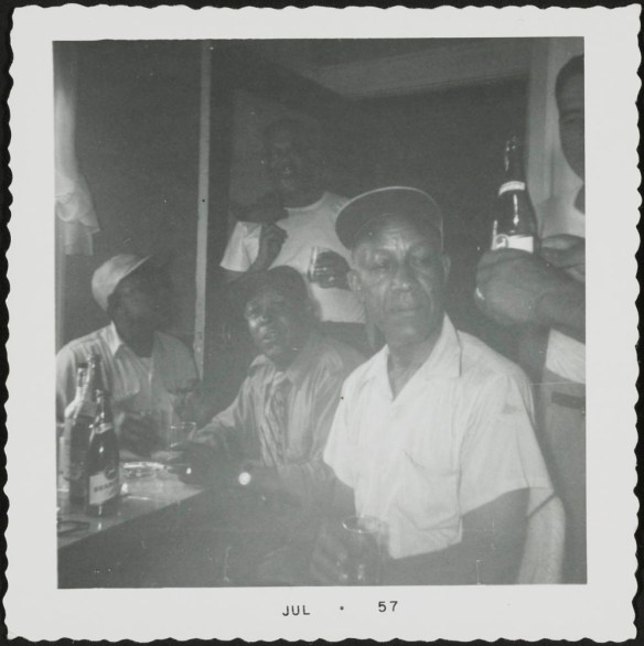Group of Canadian Pacific Railway sleeping car porters gathered around a table.