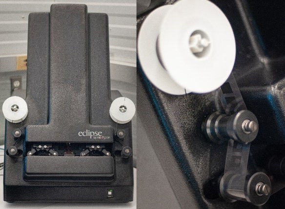 Two photographs of the Eclipse Rollfilm scanner by nextScan; on the left, a view showing the full scanner, and on the right, a close-up of the reel with some film threading past two of the rollers.