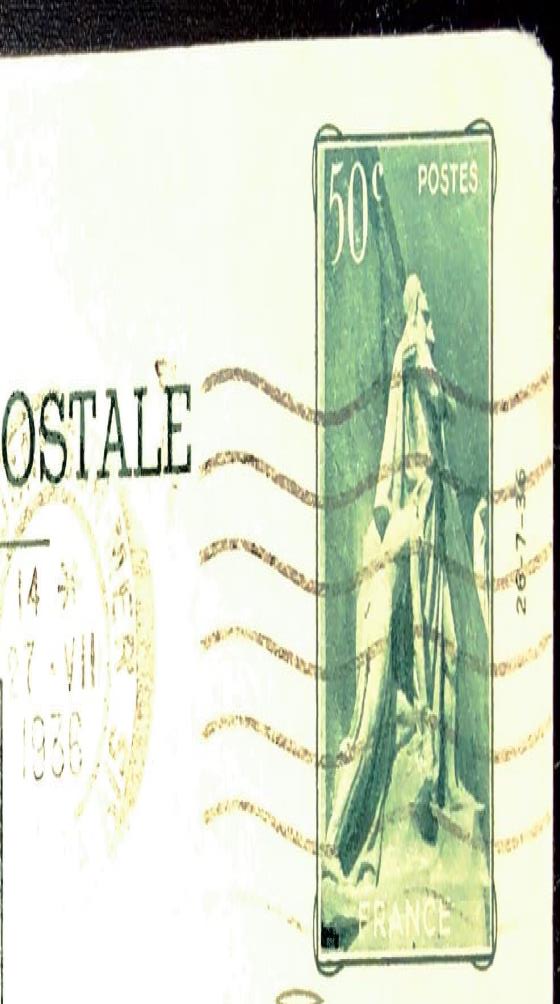 A green-hued stamp depicting a stone sculpture from the Vimy Memorial. The stamp has been cancelled, and a partial postmark is visible to the left of the image.