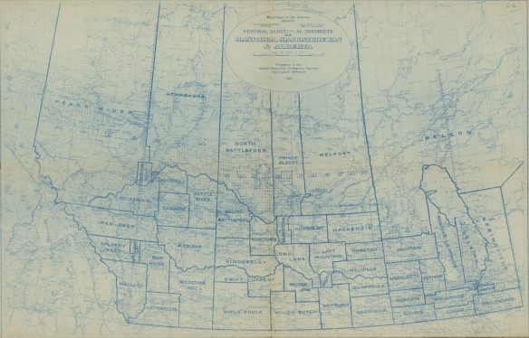 A map depicting federal electoral districts in the prairie provinces—the boundaries are indicated by thick blue lines, and the names are indicated in blue type. The map was prepared on a base map featuring rivers and lakes, railways, cities and grid lines.