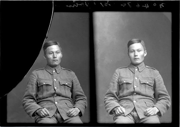 Group of five men standing or sitting.