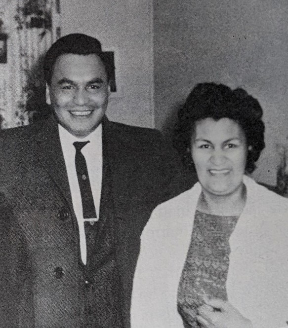 Photo of a man and a woman looking directly at the camera and smiling.